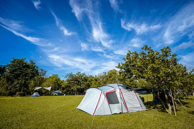 Tent in field against sky