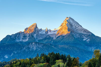 The first sunlight hits the famous mount watzmann in the bavarian alps