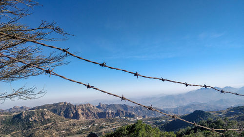 View of barbed wire against sky