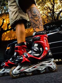 Low section of woman standing on tiled floor