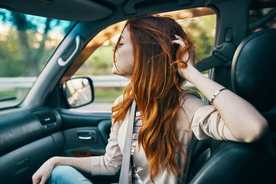 Woman sitting in car