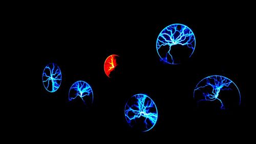 Low angle view of illuminated ferris wheel