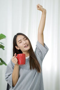Young woman drinking water