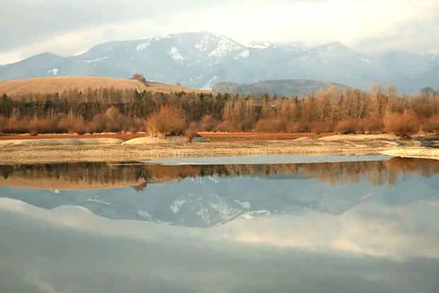 tranquil scene, mountain, tranquility, scenics, winter, snow, lake, cold temperature, beauty in nature, reflection, water, mountain range, nature, sky, waterfront, season, landscape, tree, idyllic, non-urban scene