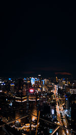 High angle view of illuminated buildings in city at night