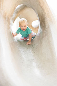 High angle view of girl playing in lake