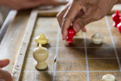 Close-up of hand playing board game