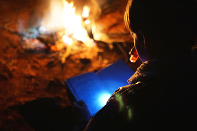 Close-up of person reading book