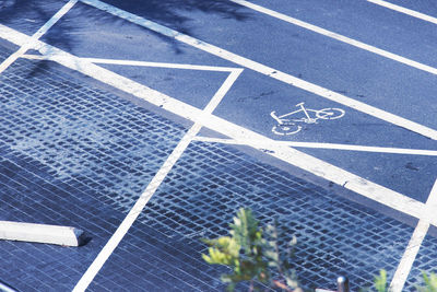 High angle view of arrow symbol on road