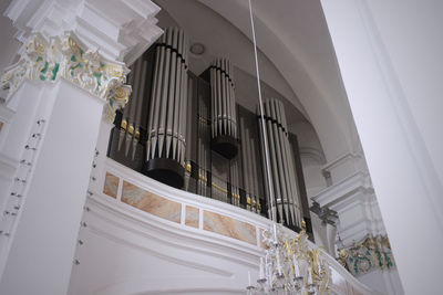 Low angle view of pipe organ in church