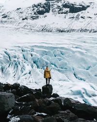 Man standing on snow covered mountain