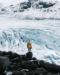 Man standing on snow covered mountain