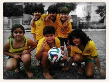 Portrait of happy boy playing with ball