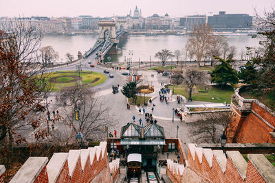 High angle view of bridge over river against buildings