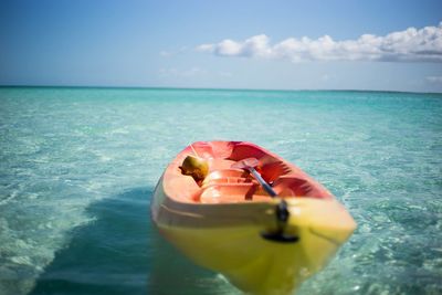 Close-up of person in sea against sky