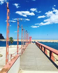 Pier over sea against sky