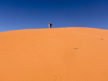 Scenic view of desert against clear sky