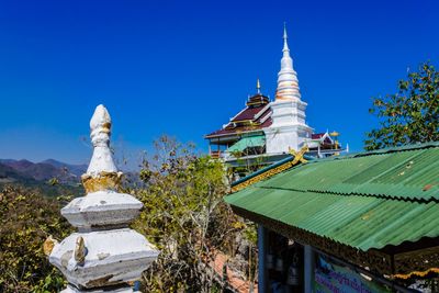 View of temple building against blue sky