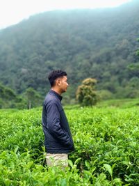 Lyoung man standing on field