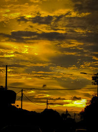 Low angle view of dramatic sky during sunset