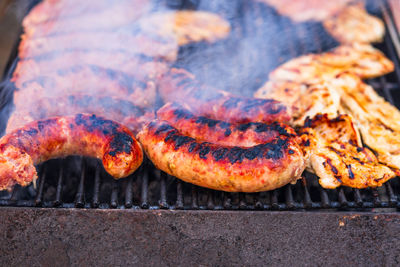 Close-up of meat on barbecue grill