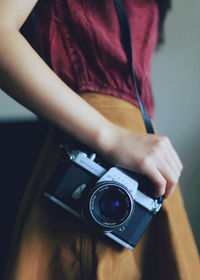 Midsection of woman photographing