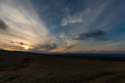 Scenic view of landscape against sky during sunset