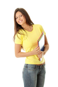 Portrait of a smiling young woman against white background