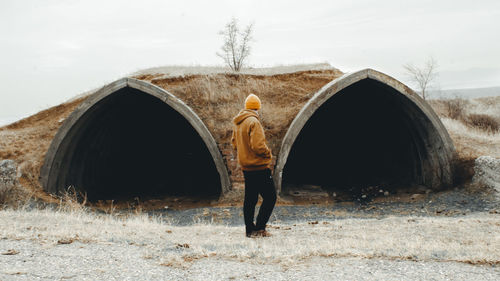 Rear view of man standing on road