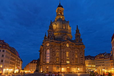 Low angle view of illuminated buildings at night