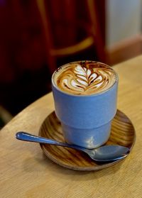 Close-up of cappuccino on table