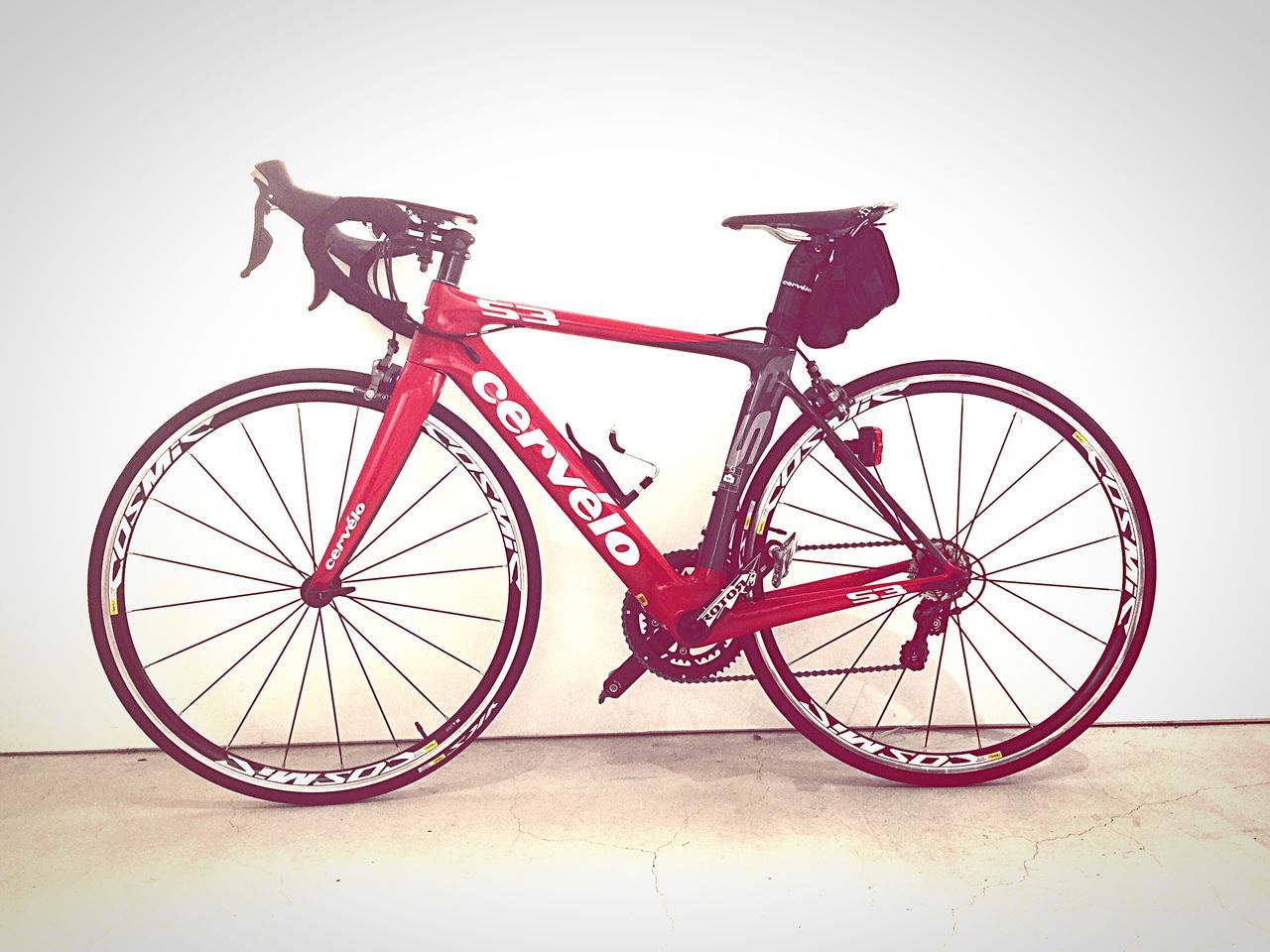 bicycle, wheel, transportation, mode of transport, time, clear sky, land vehicle, stationary, copy space, clock, wall - building feature, old-fashioned, low angle view, outdoors, no people, day, old, clock face, circle, travel