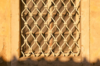 Close-up of metal grate window