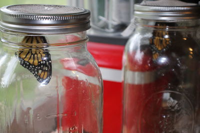 Close-up of drink in glass jar on table