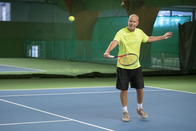 Man playing tennis