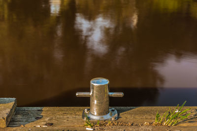 Close-up of faucet in water