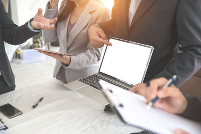 Business colleagues working at desk in office