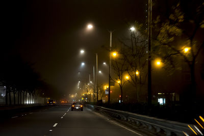 Cars on road at night