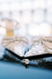 Close-up of wedding rings on table