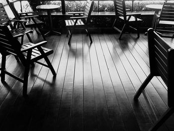 High angle view of empty chairs and tables in restaurant