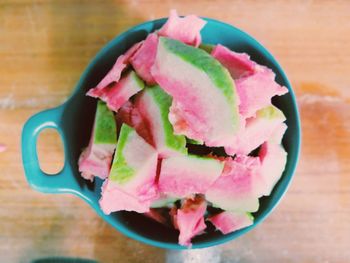 High angle view of chopped fruits in bowl on table