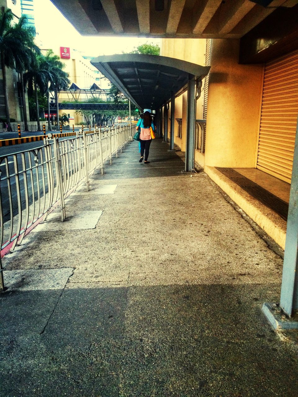 architecture, built structure, walking, the way forward, rear view, full length, men, lifestyles, building exterior, person, railing, leisure activity, diminishing perspective, unrecognizable person, walkway, steps, standing, vanishing point