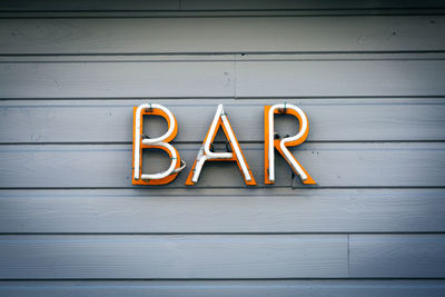 Close-up of yellow text on wood