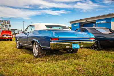 Vintage car parked against blue sky