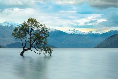 Scenic view of snowcapped mountains and lake against sky