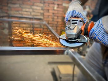 Man working on barbecue grill