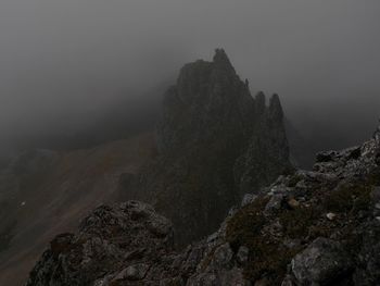 Rock formation on mountain against sky