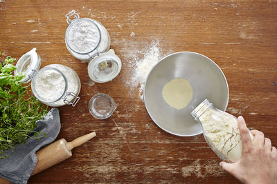 High angle view of hand on table