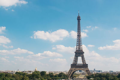 Eiffel tower against sky in city