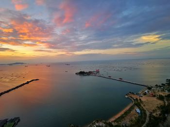 Scenic view of sea against sky at sunset